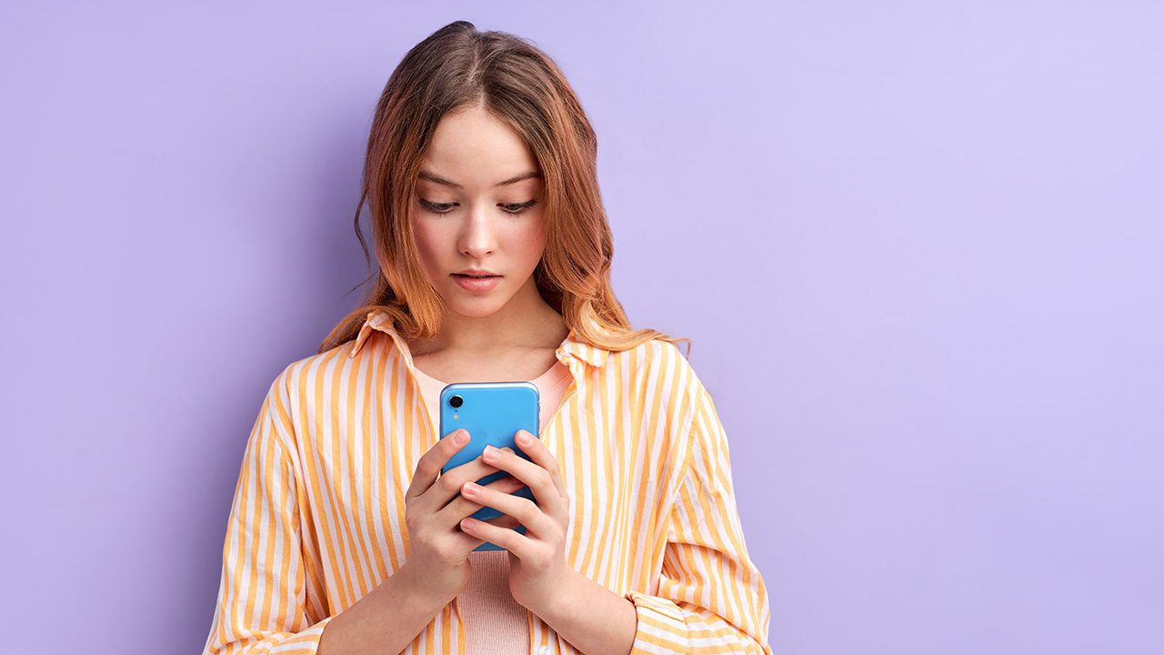 Student looking up contact on phone